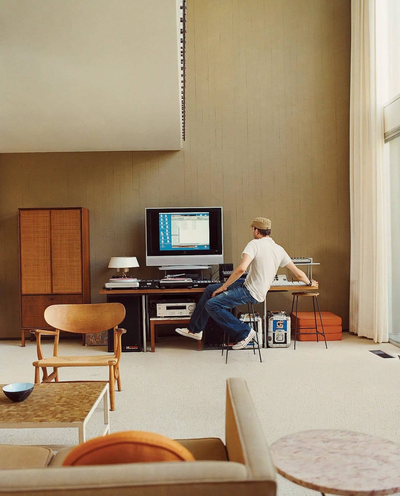 Writer at a desk in a period interior